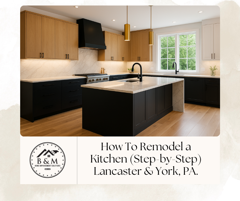 Custom two-tone kitchen with rift-cut white oak uppers, matte black base cabinets, waterfall quartz island, and brass pendants in Lancaster, PA.