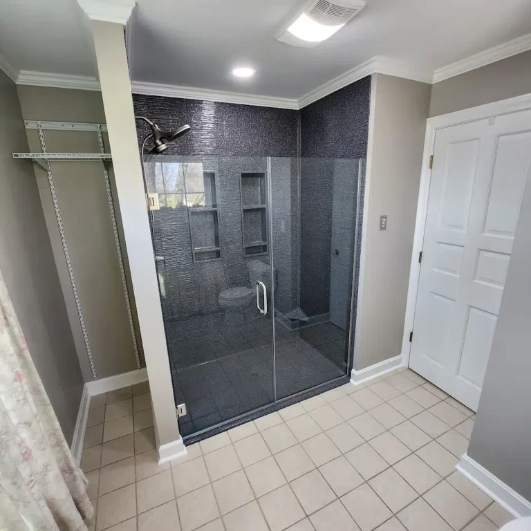 Onyx shower with distinctive dark fixtures