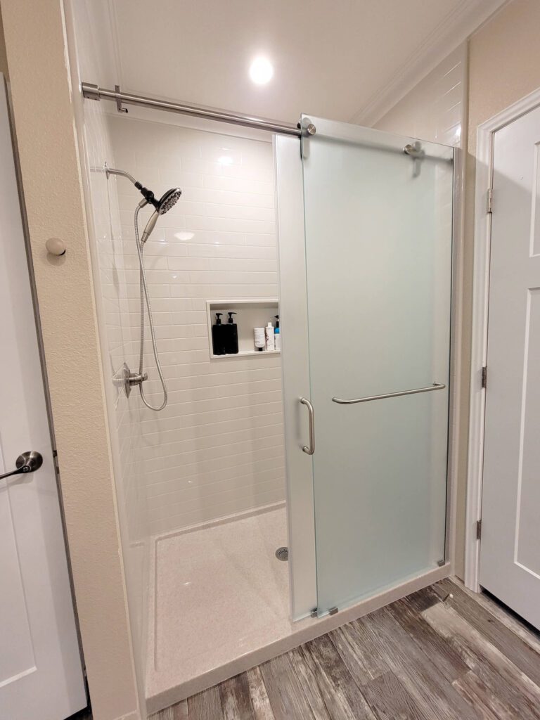 Finished Onyx solid-surface shower with light wall panels